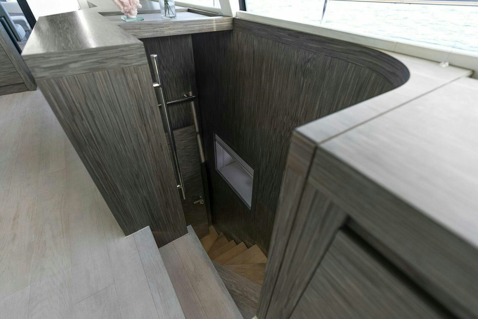 a wooden shelf with a computer on it aboard PHOENIX RISING Yacht for Sale