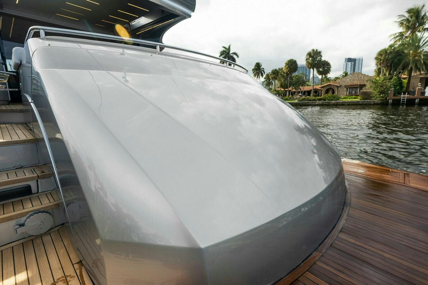 a large white boat on a dock aboard PHOENIX RISING Yacht for Sale