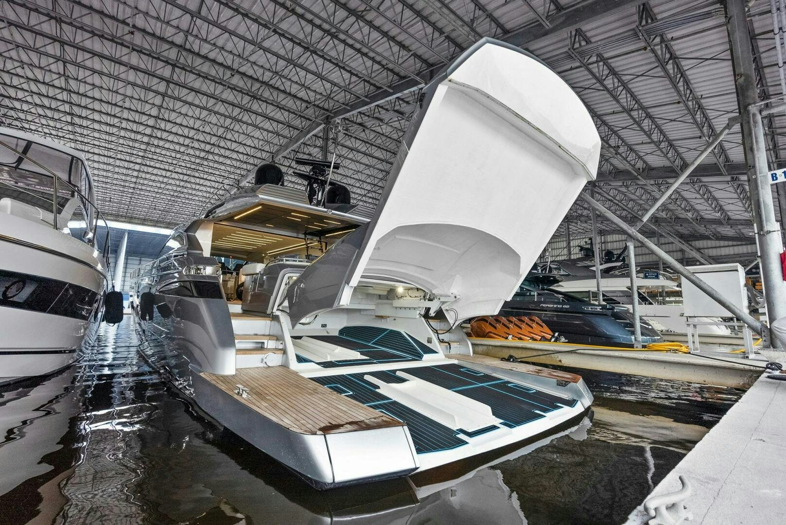 a large airplane in a hangar aboard PHOENIX RISING Yacht for Sale