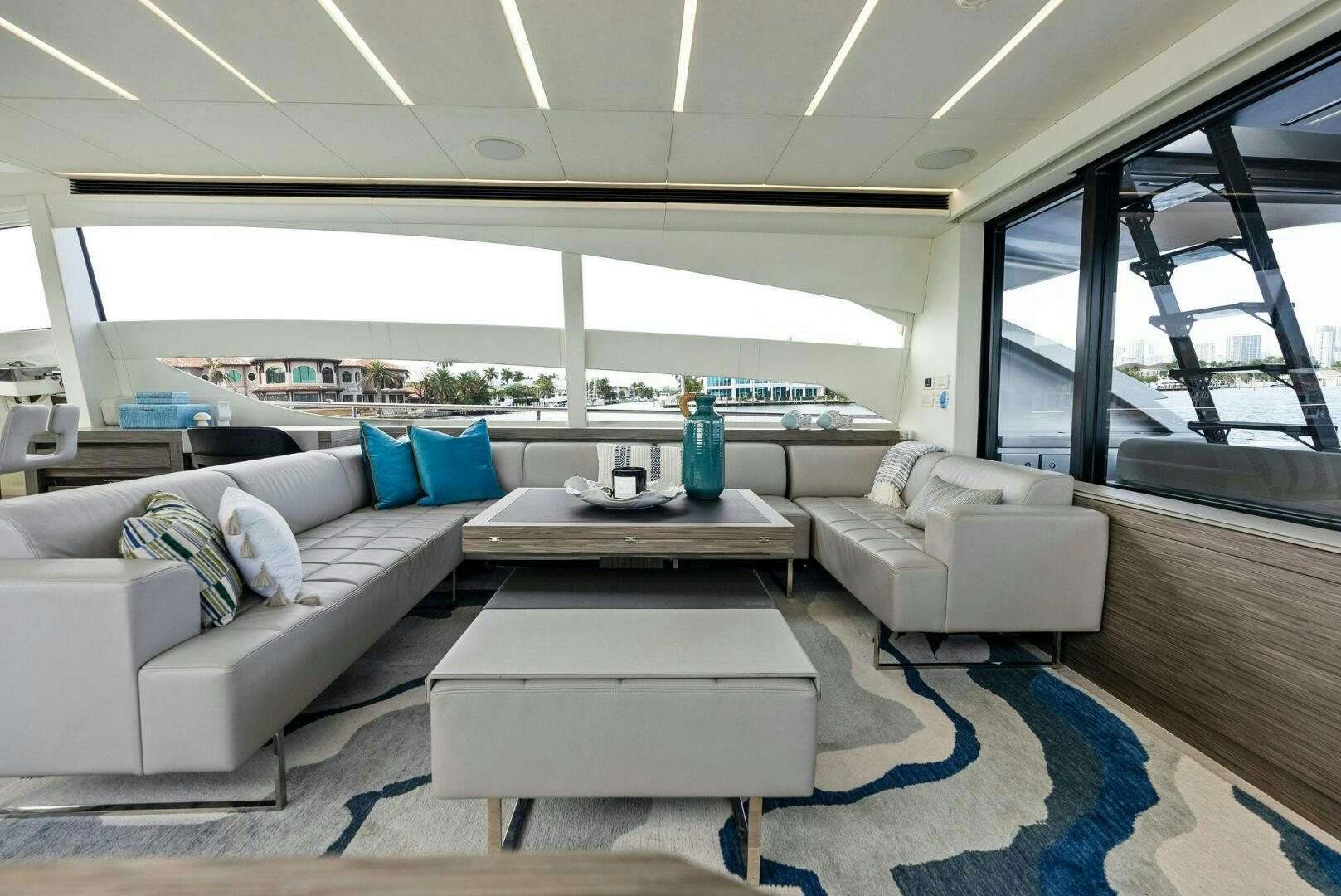 a living room with a large window aboard PHOENIX RISING Yacht for Sale