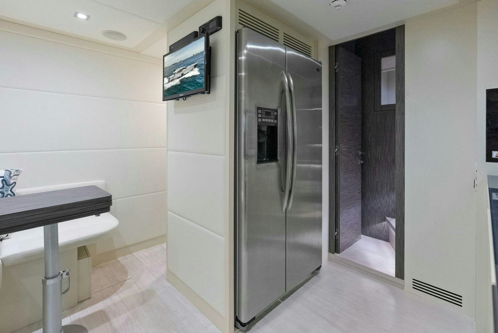 a large refrigerator in a room aboard PHOENIX RISING Yacht for Sale
