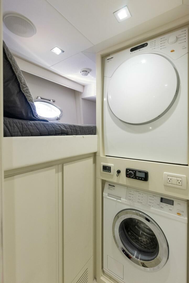a white washing machine aboard PHOENIX RISING Yacht for Sale
