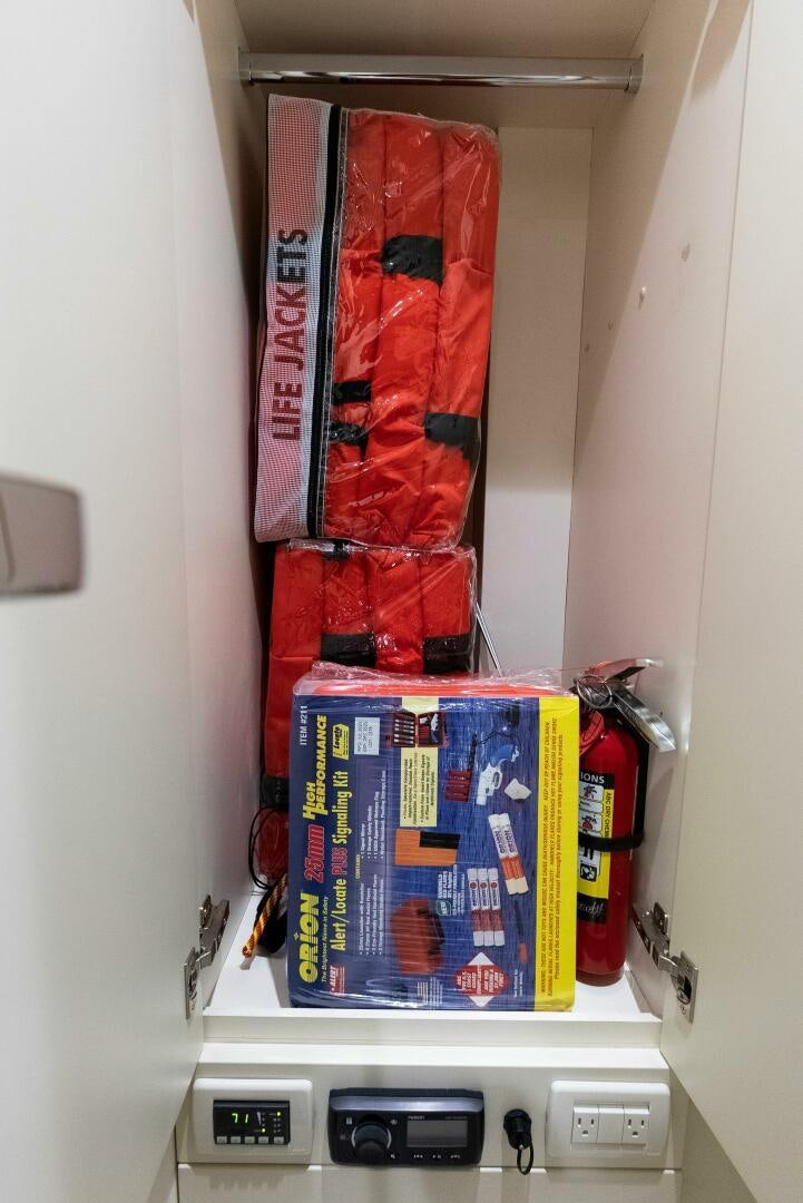 a shelf with a red and blue object on it aboard PHOENIX RISING Yacht for Sale