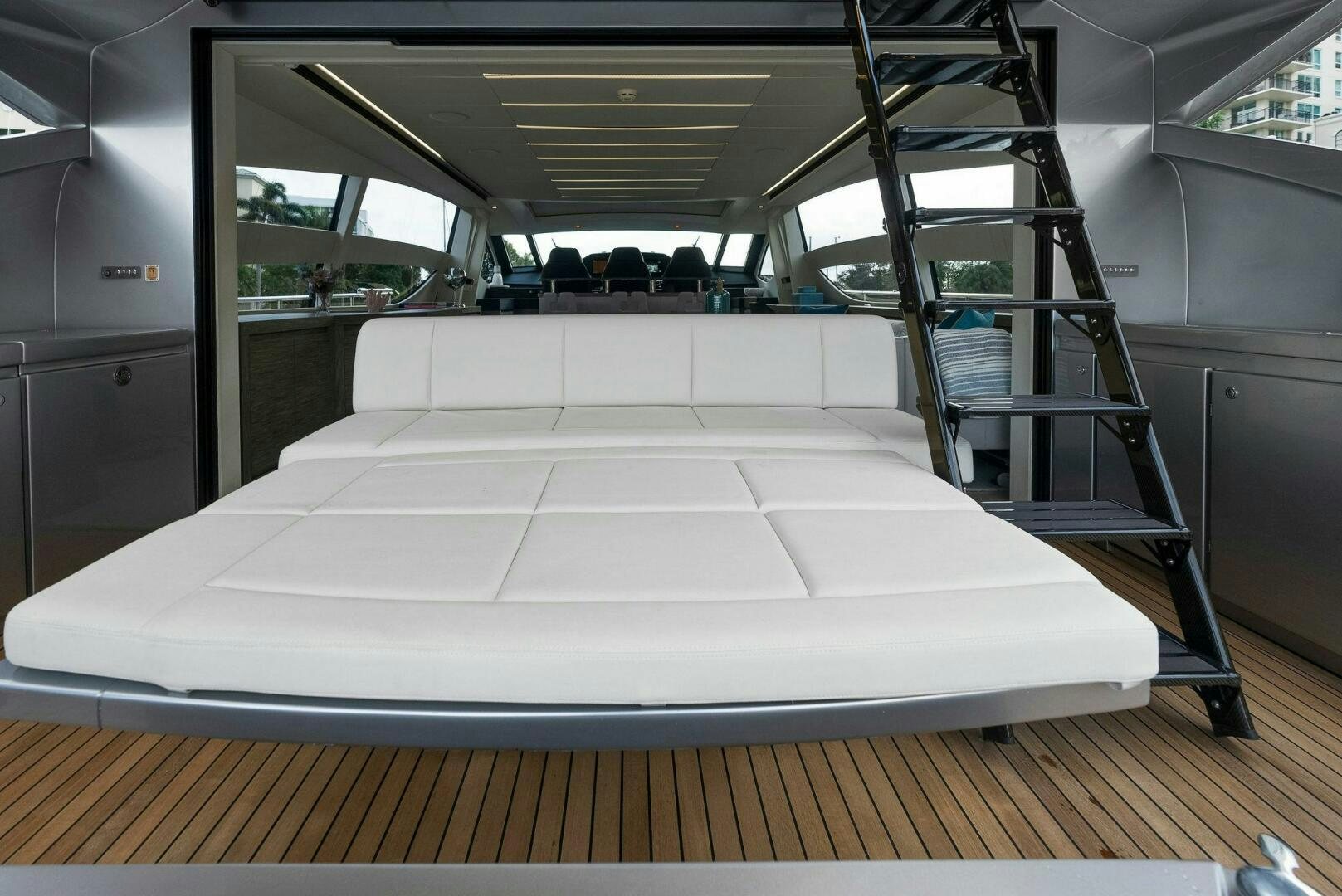 a large room with a staircase aboard PHOENIX RISING Yacht for Sale