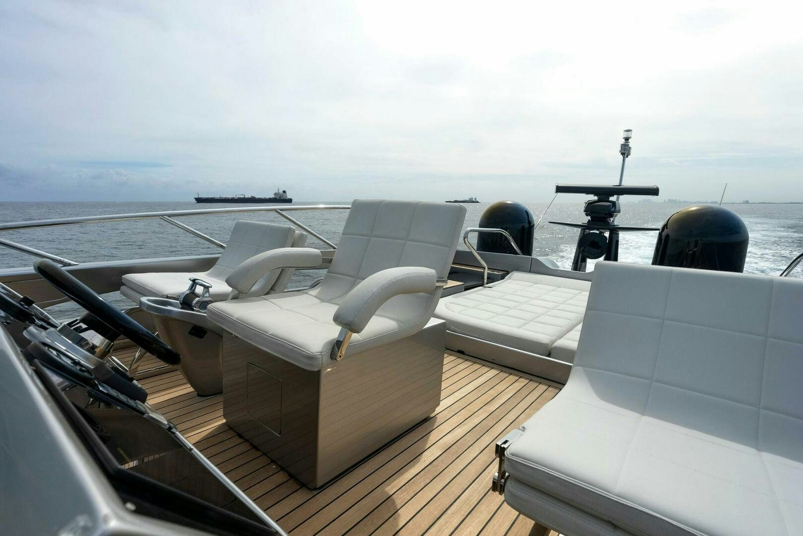 a boat with a chair and a camera on it aboard PHOENIX RISING Yacht for Sale