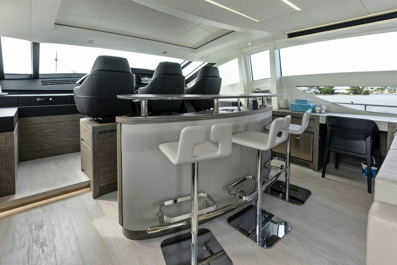 a room with chairs and tables aboard PHOENIX RISING Yacht for Sale