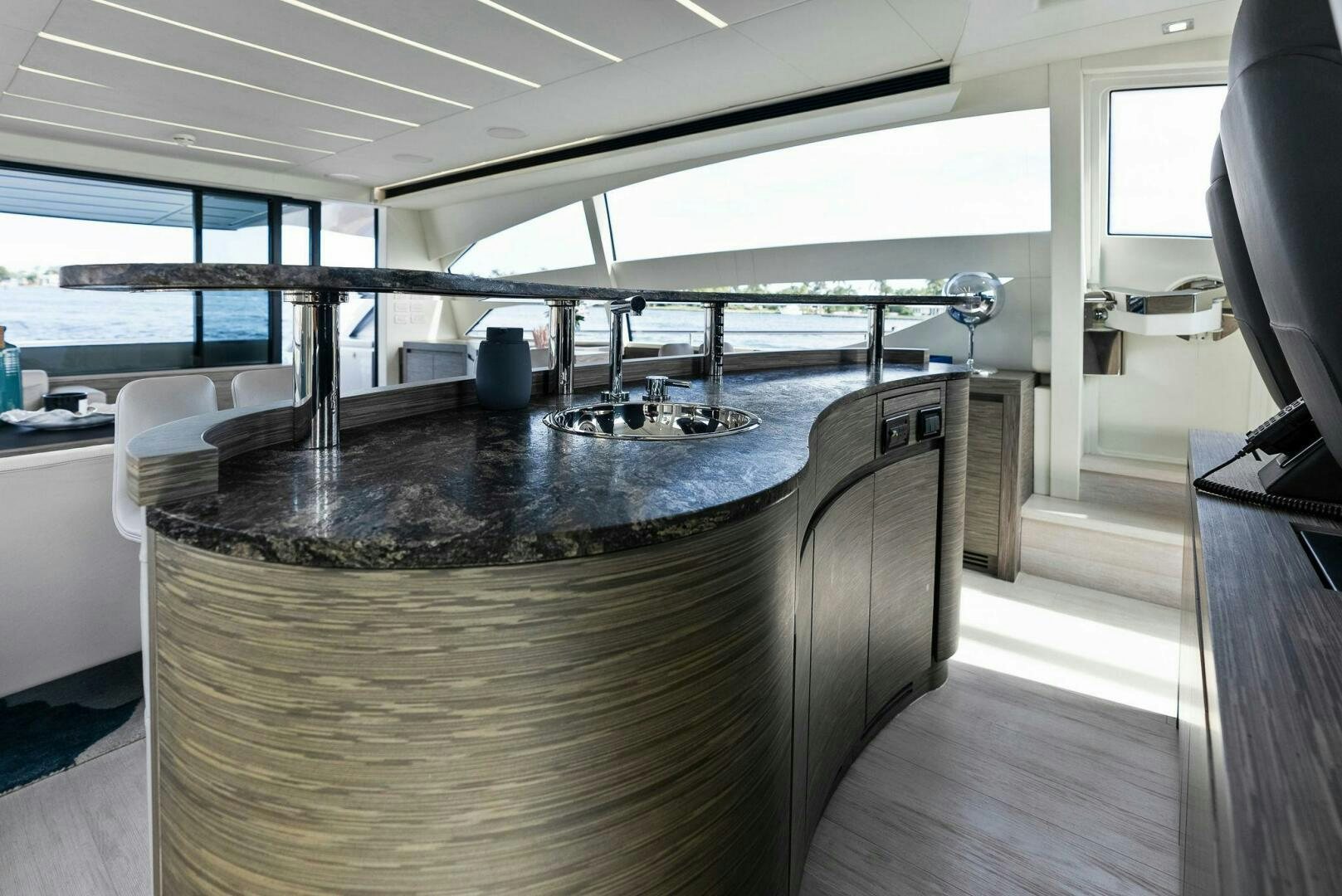 a large kitchen with a large bar aboard PHOENIX RISING Yacht for Sale