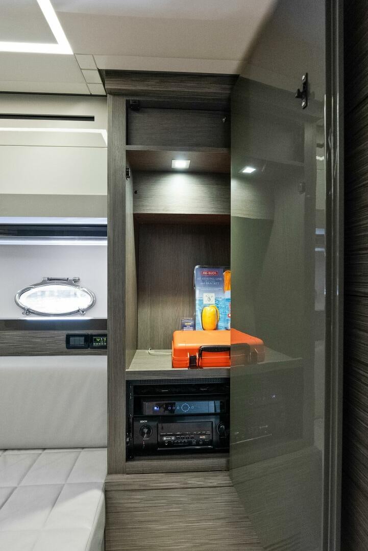 a kitchen with a sink and a mirror aboard PHOENIX RISING Yacht for Sale