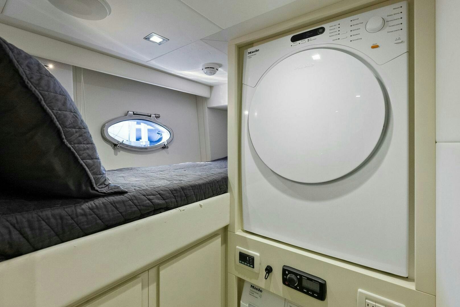 a white washing machine aboard PHOENIX RISING Yacht for Sale