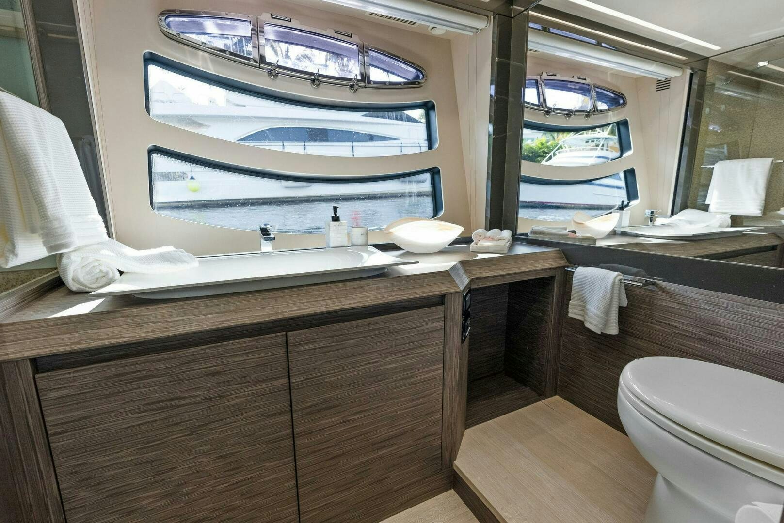 a bathroom with a large mirror aboard PHOENIX RISING Yacht for Sale