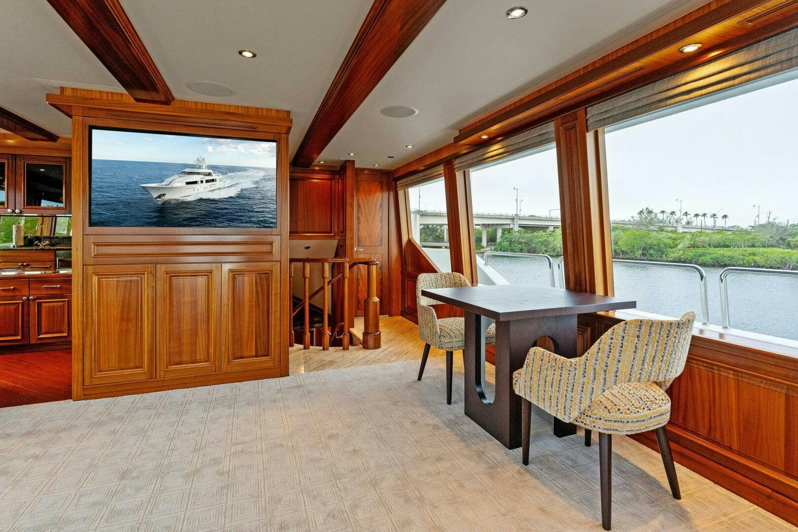 a room with a table and chairs aboard ANTARES Yacht for Sale
