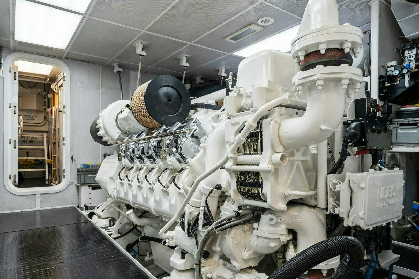 a large white robot in a room aboard ANTARES Yacht for Sale