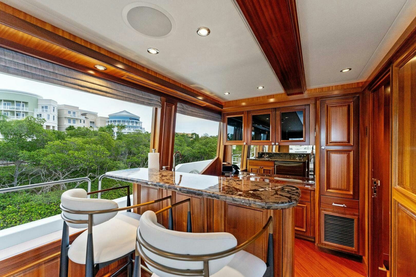 a kitchen with a table and chairs aboard ANTARES Yacht for Sale