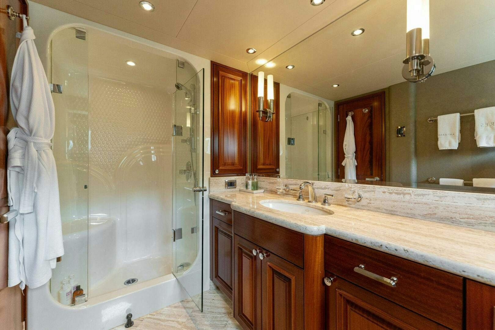 a bathroom with a glass shower aboard ANTARES Yacht for Sale