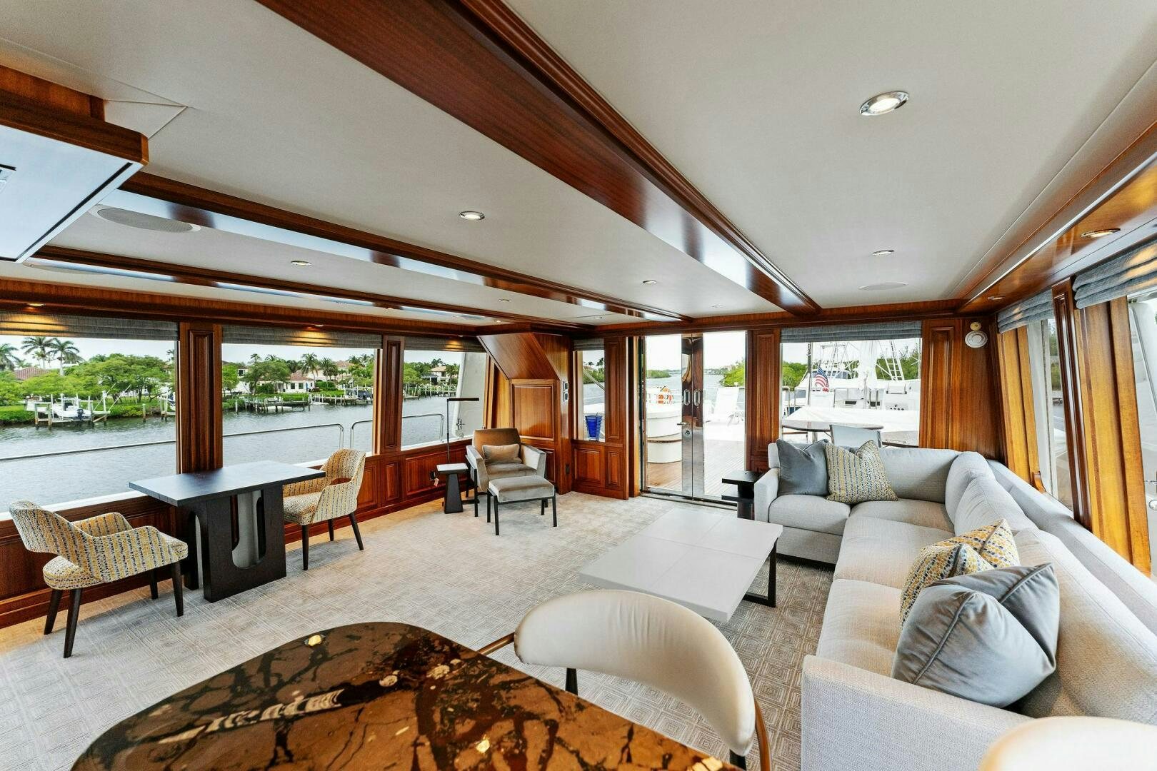 a living room with a large open window aboard ANTARES Yacht for Sale