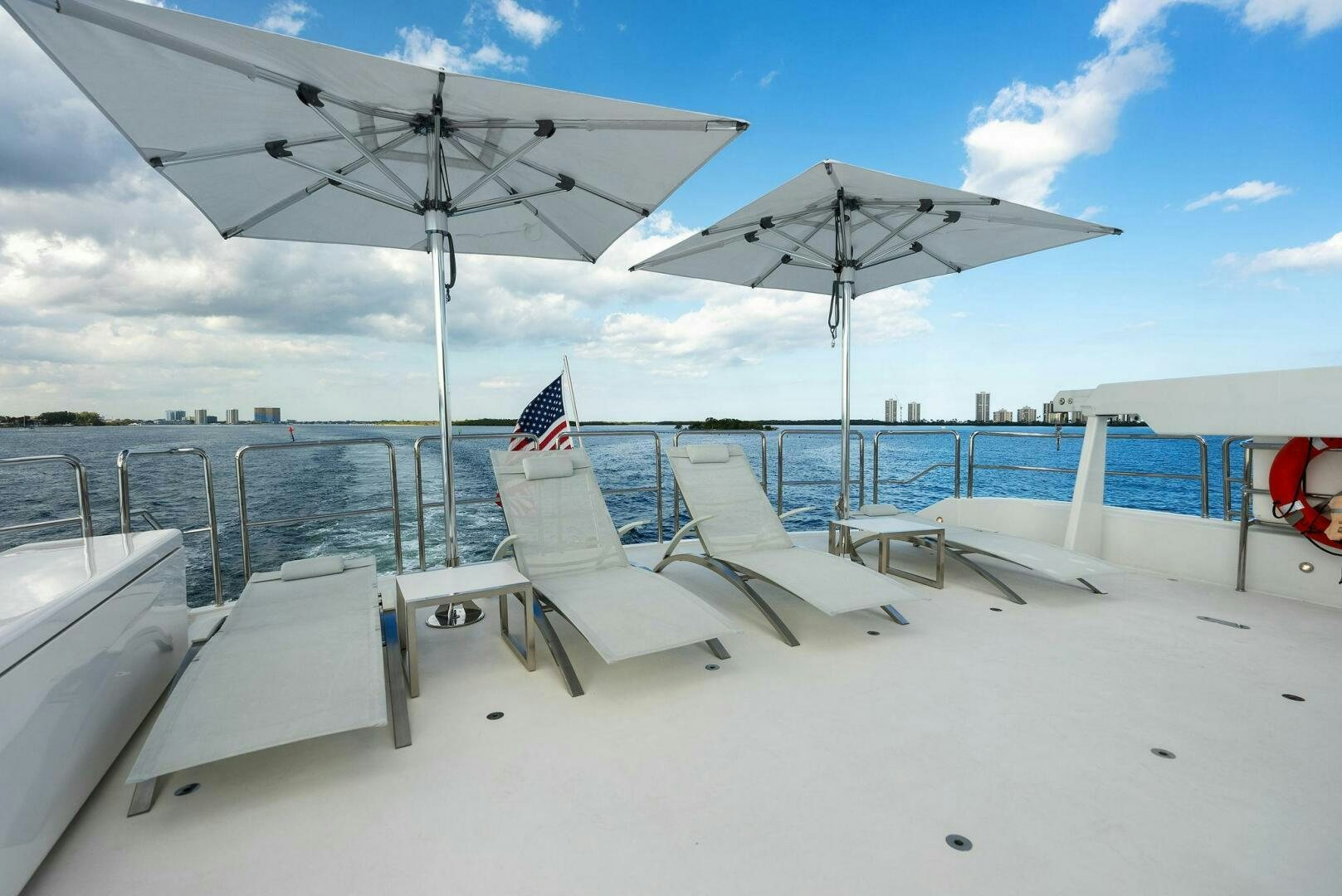 chairs and umbrellas on a beach aboard ANTARES Yacht for Sale