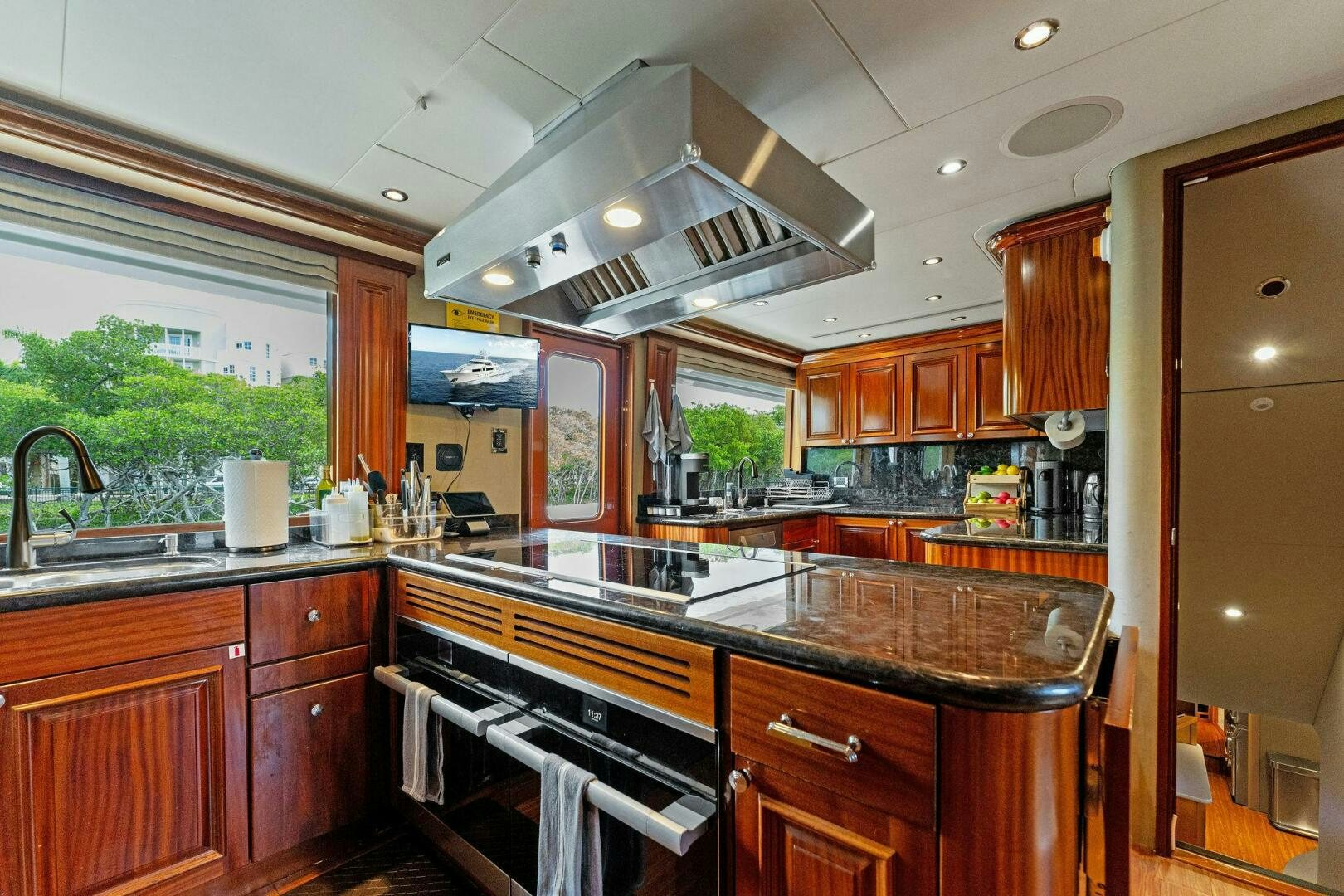 a kitchen with wooden cabinets aboard ANTARES Yacht for Sale