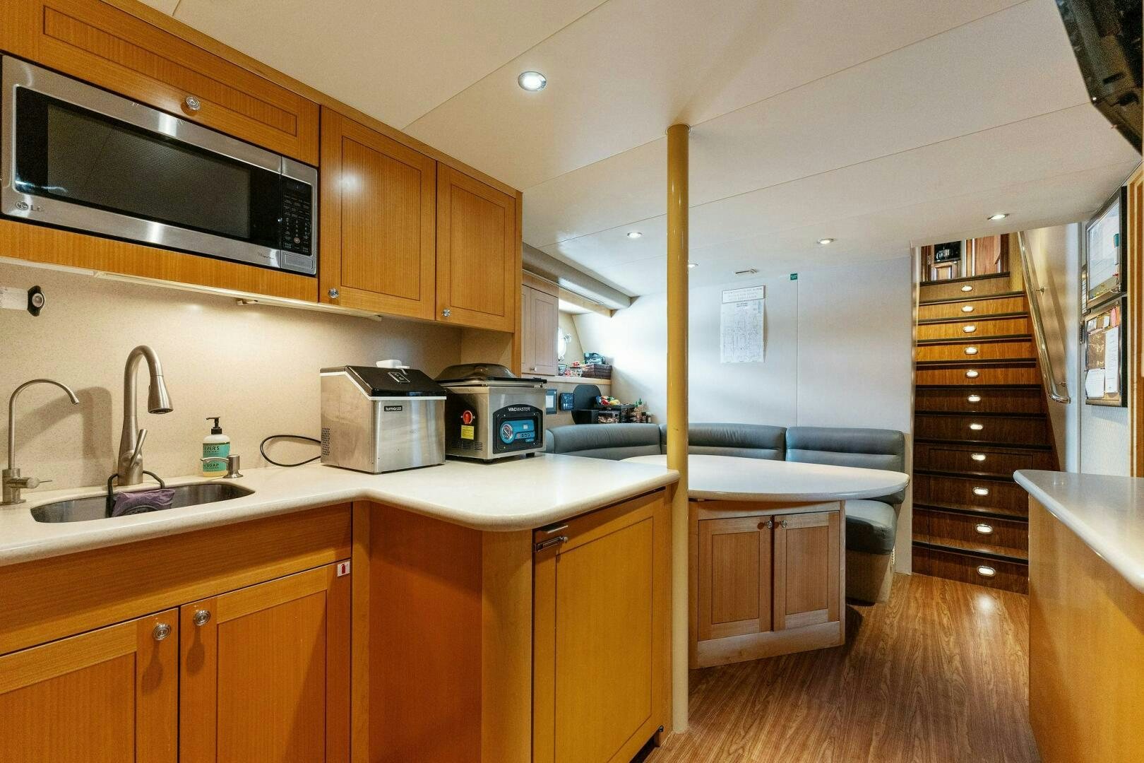 a kitchen with wooden cabinets aboard ANTARES Yacht for Sale