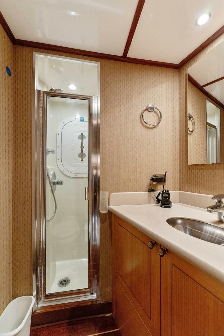 a bathroom with a shower unit and sink aboard ANTARES Yacht for Sale