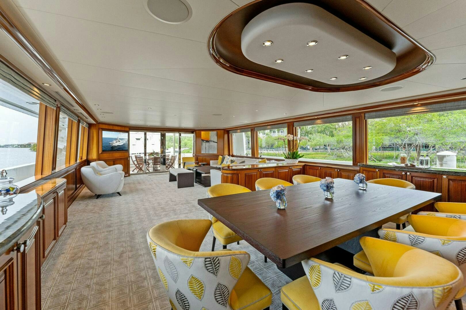 a large living room with a large open window aboard ANTARES Yacht for Sale
