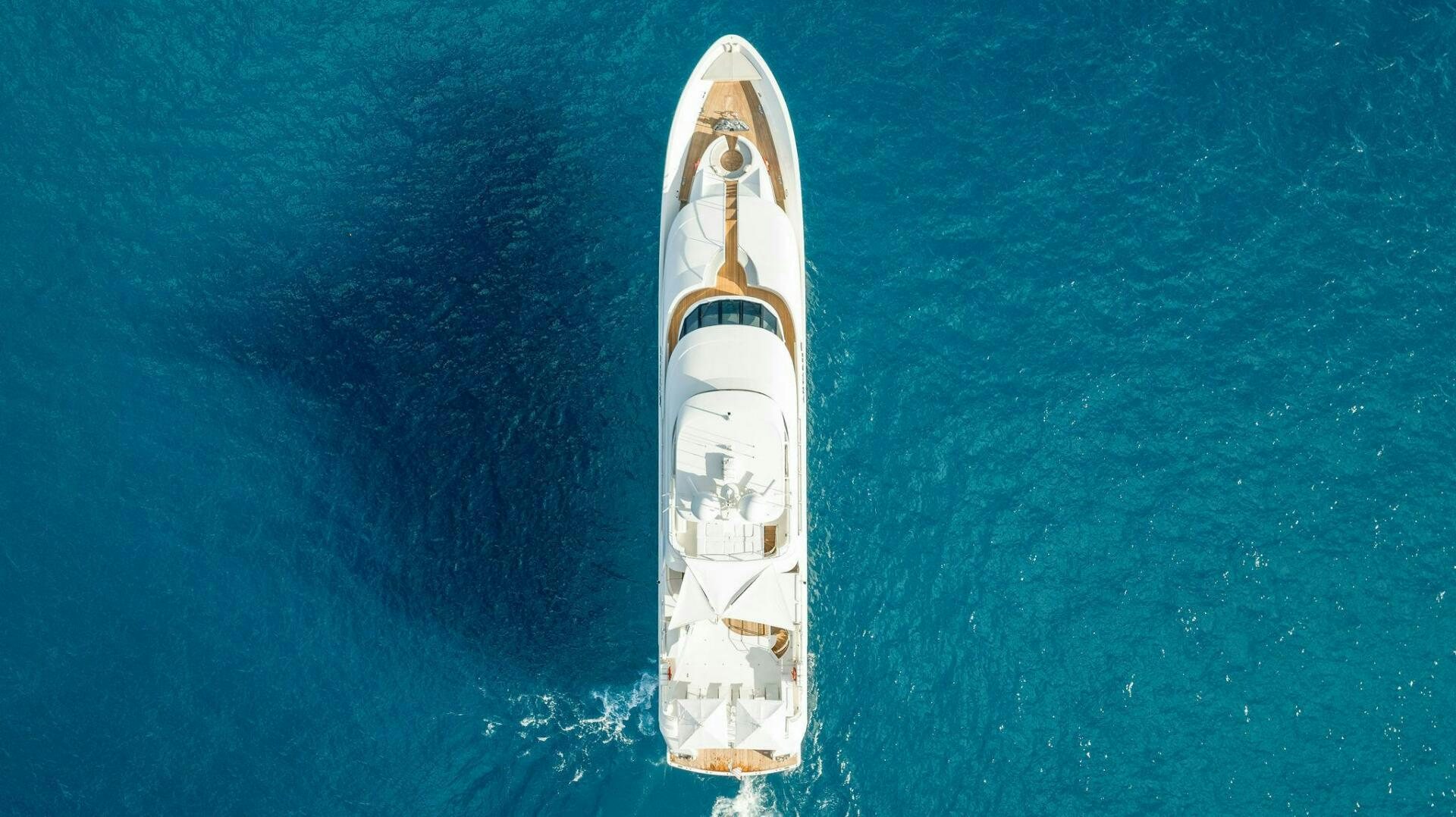 a white rocket floating in the blue water aboard ANTARES Yacht for Sale