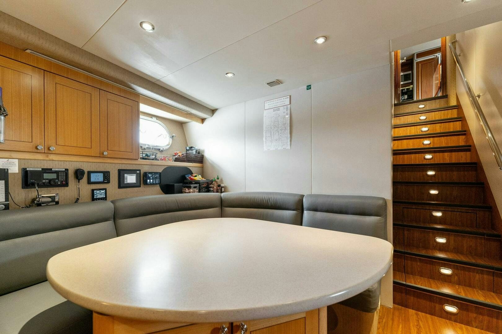 a room with a table and couch aboard ANTARES Yacht for Sale