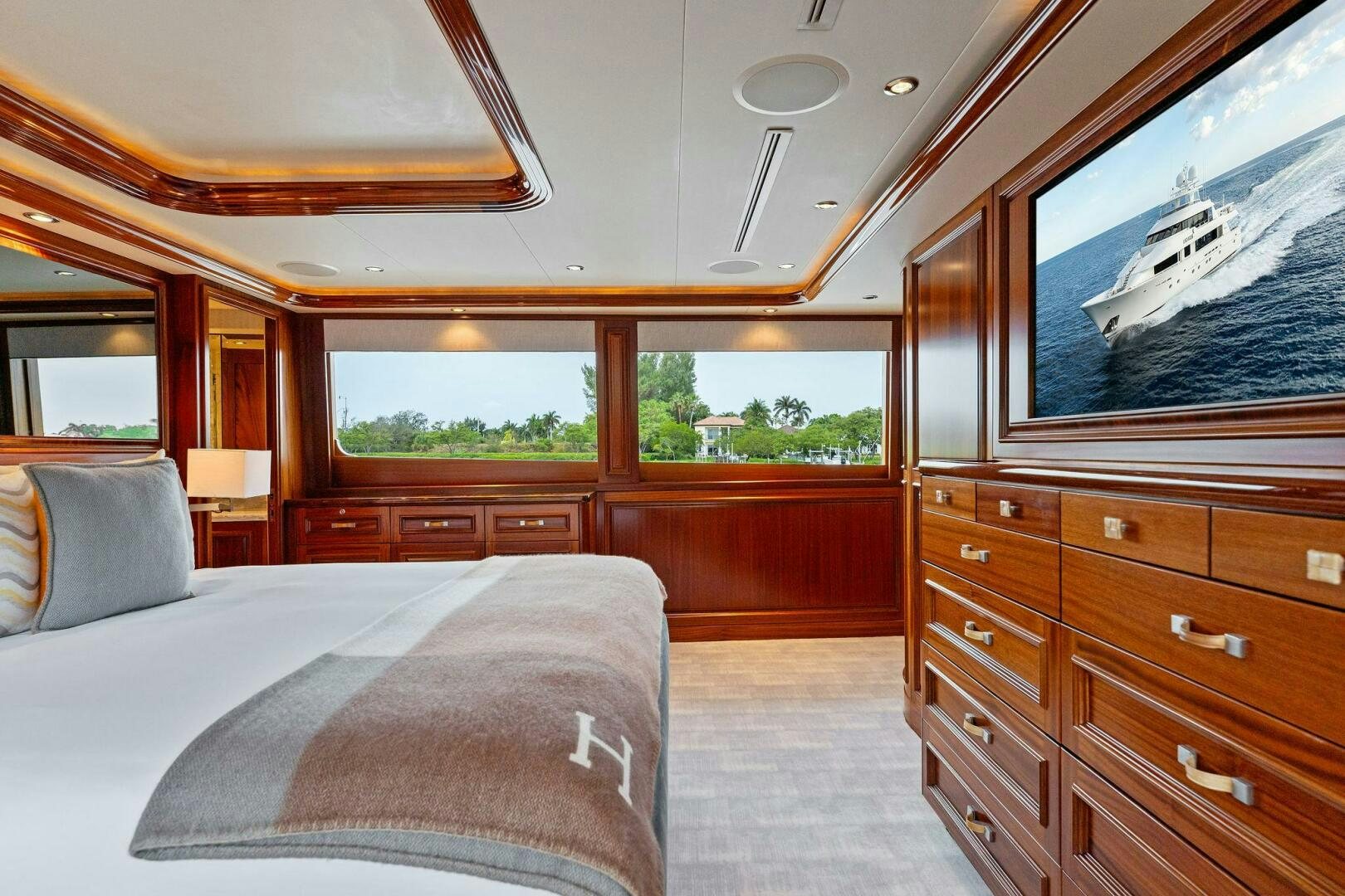 a cabin with a bed and a television aboard ANTARES Yacht for Sale