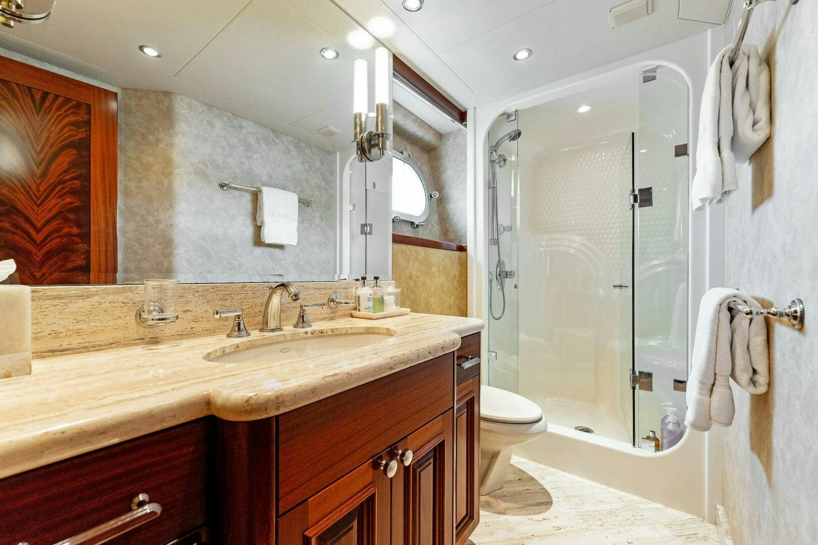 a bathroom with a shower and sink aboard ANTARES Yacht for Sale