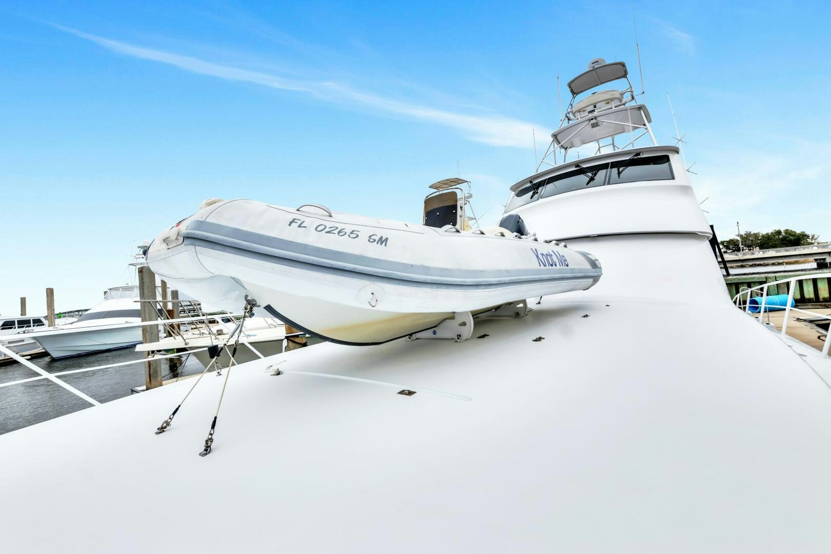 a white boat on a snowy dock aboard BERRY BLESSED Yacht for Sale