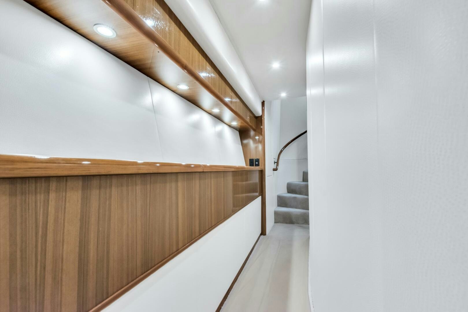 a long hallway with white walls aboard BERRY BLESSED Yacht for Sale