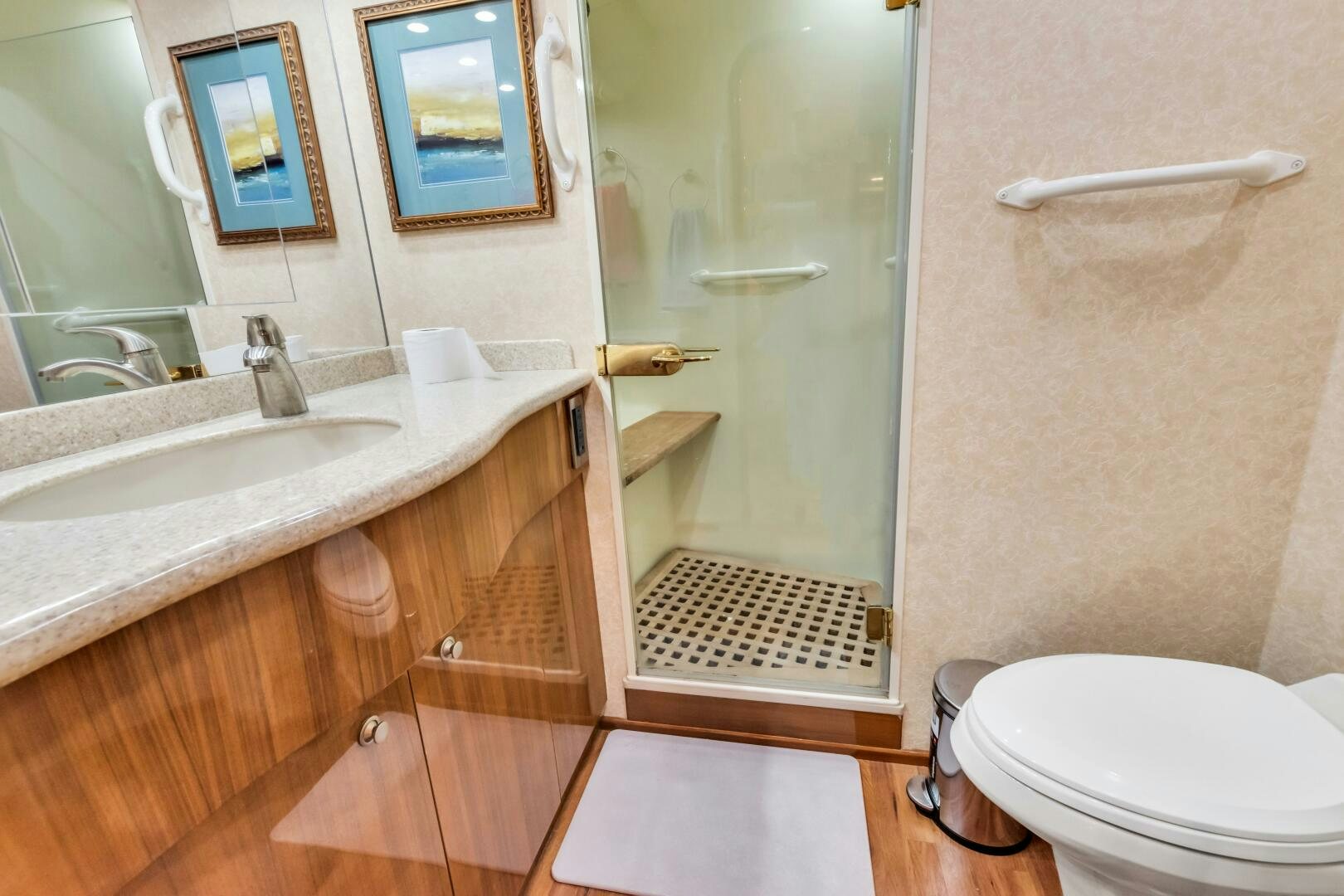 a bathroom with a glass shower door aboard BERRY BLESSED Yacht for Sale