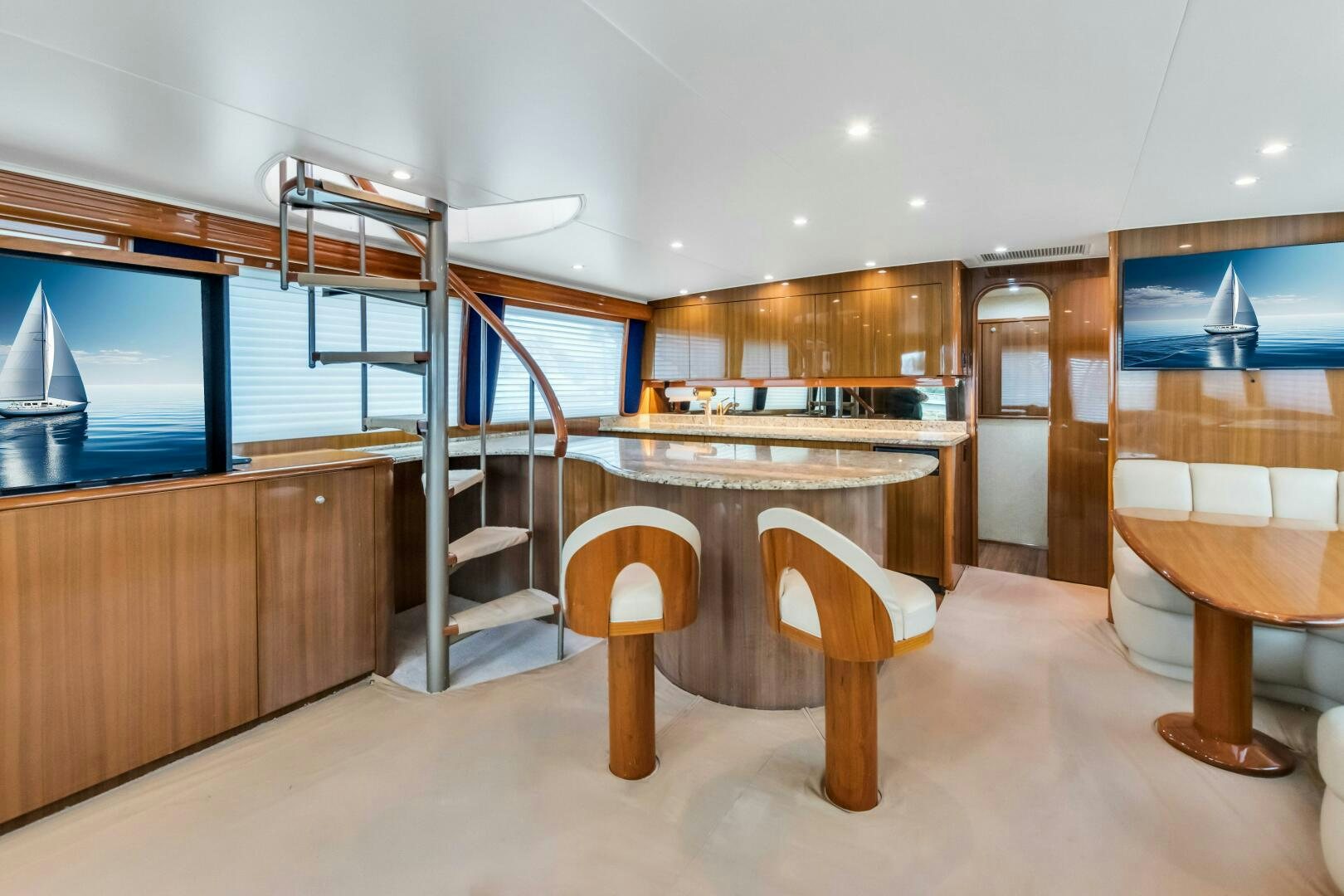 a room with a table and chairs aboard BERRY BLESSED Yacht for Sale
