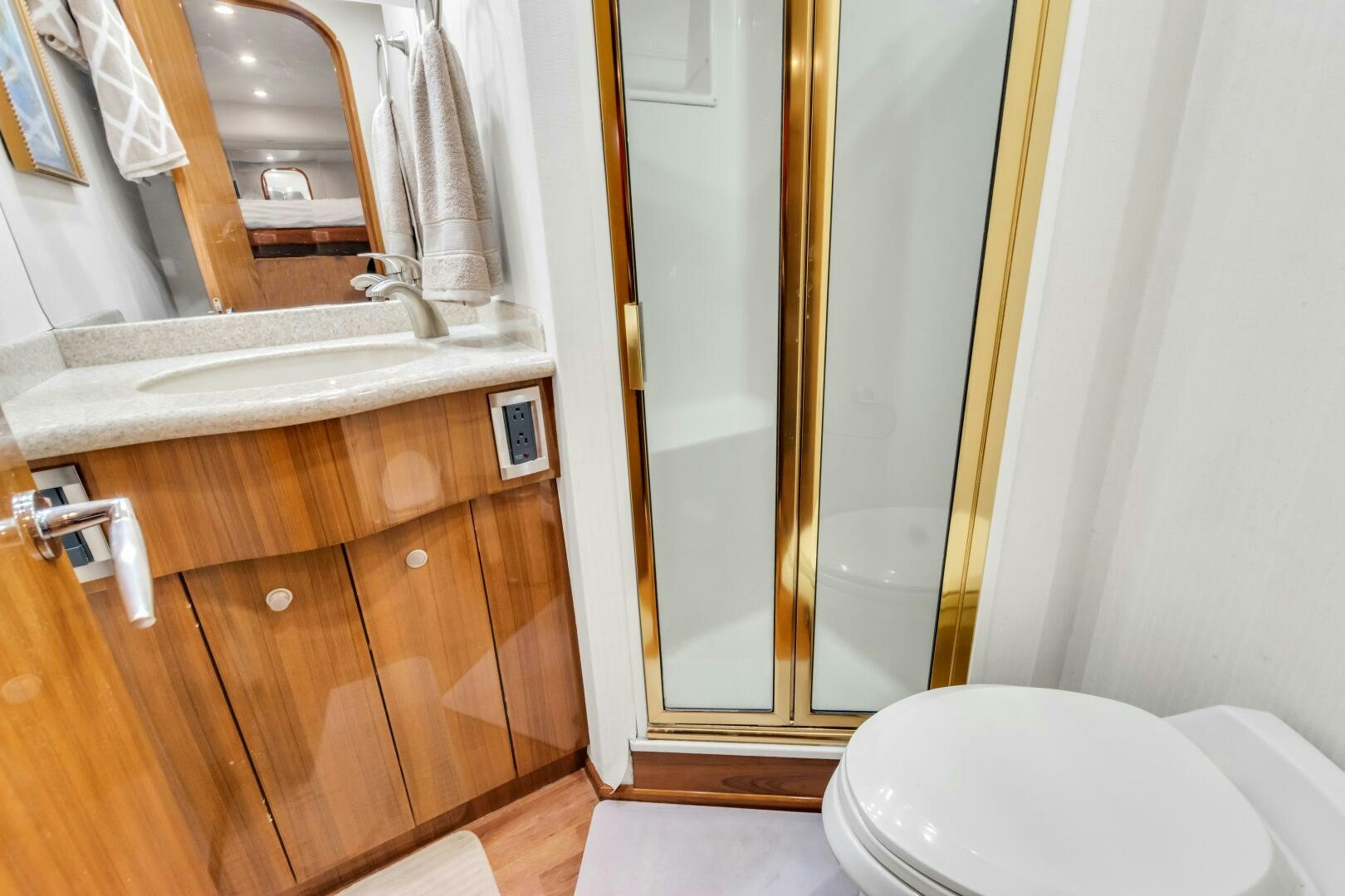 a bathroom with a sink and toilet aboard BERRY BLESSED Yacht for Sale