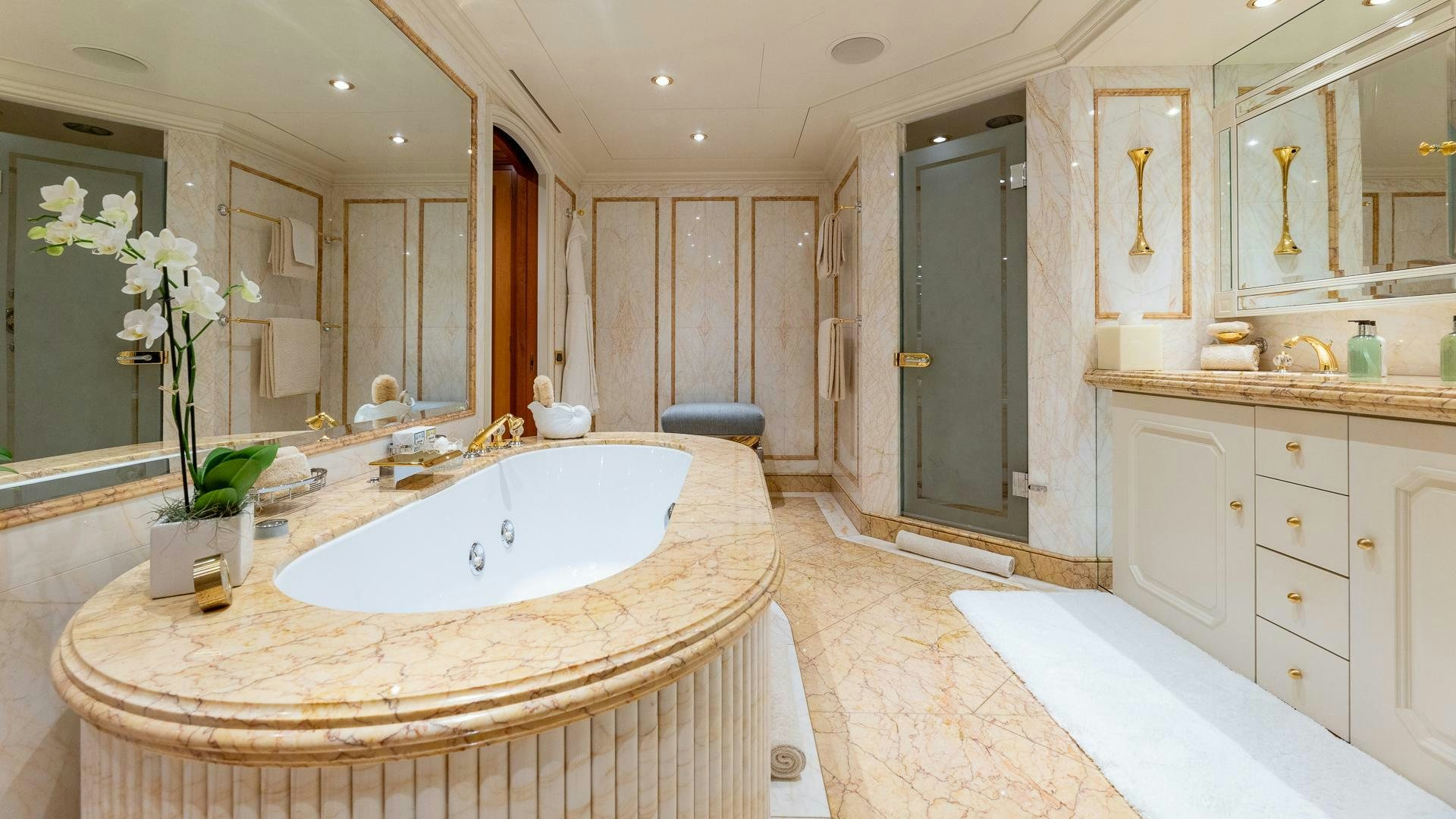 a large bathroom with a large bathtub aboard AMANTI Yacht for Sale