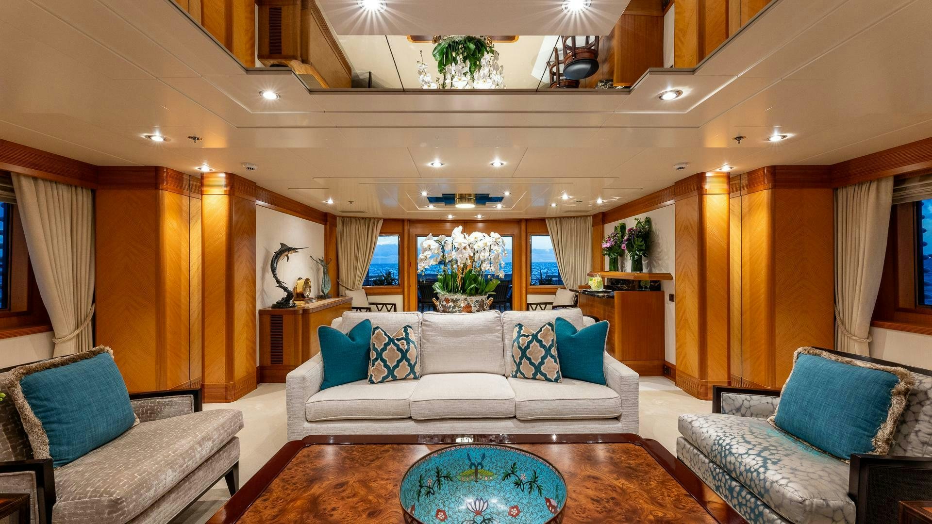 a living room with a large window aboard AMANTI Yacht for Sale