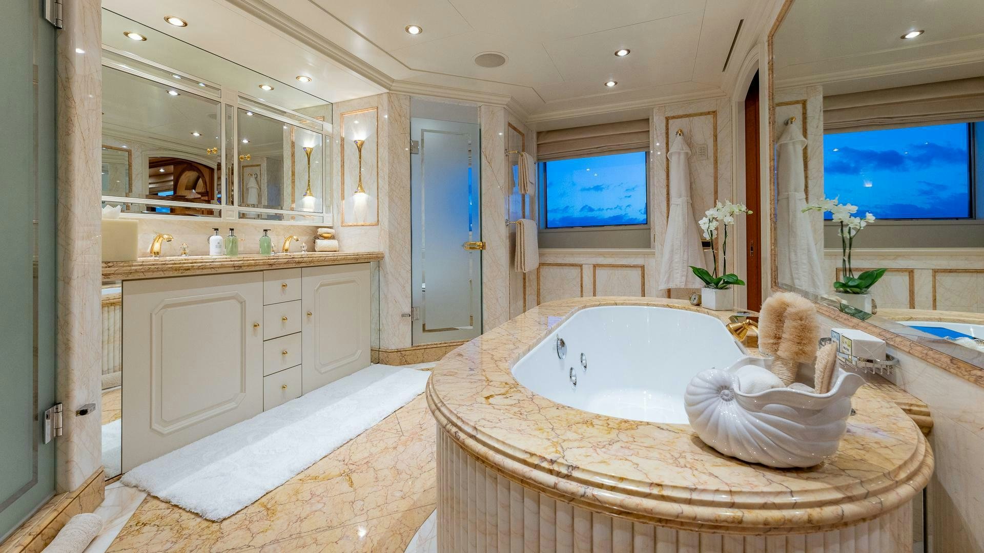 a large bathroom with a large bathtub aboard AMANTI Yacht for Sale
