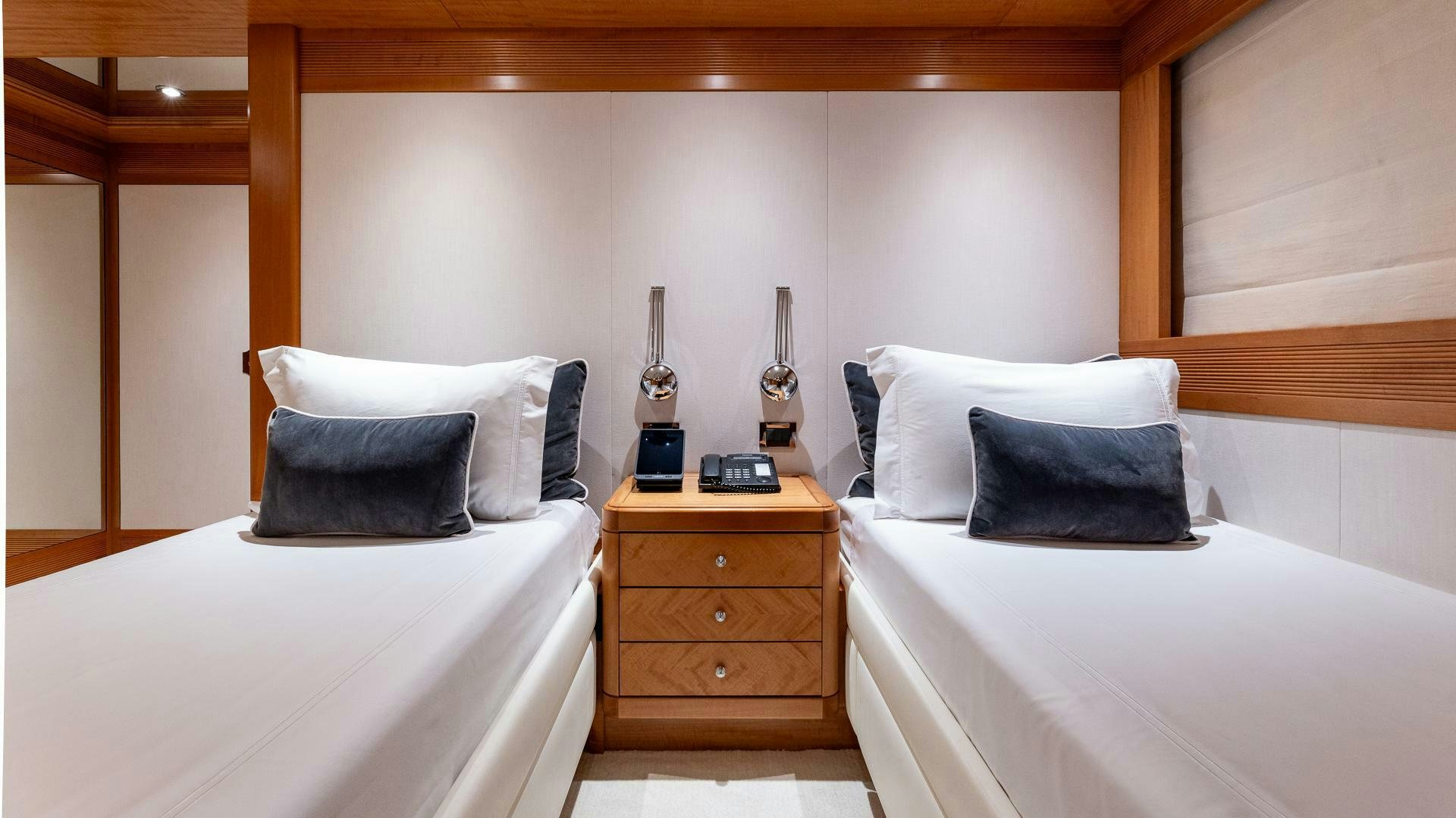 a room with two beds aboard AMANTI Yacht for Sale