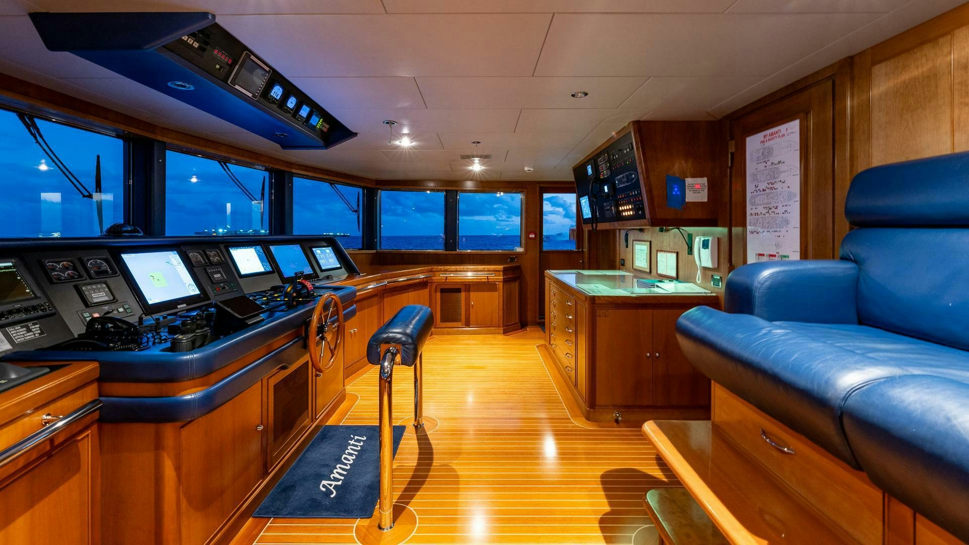 a living room with a couch and a table aboard AMANTI Yacht for Sale