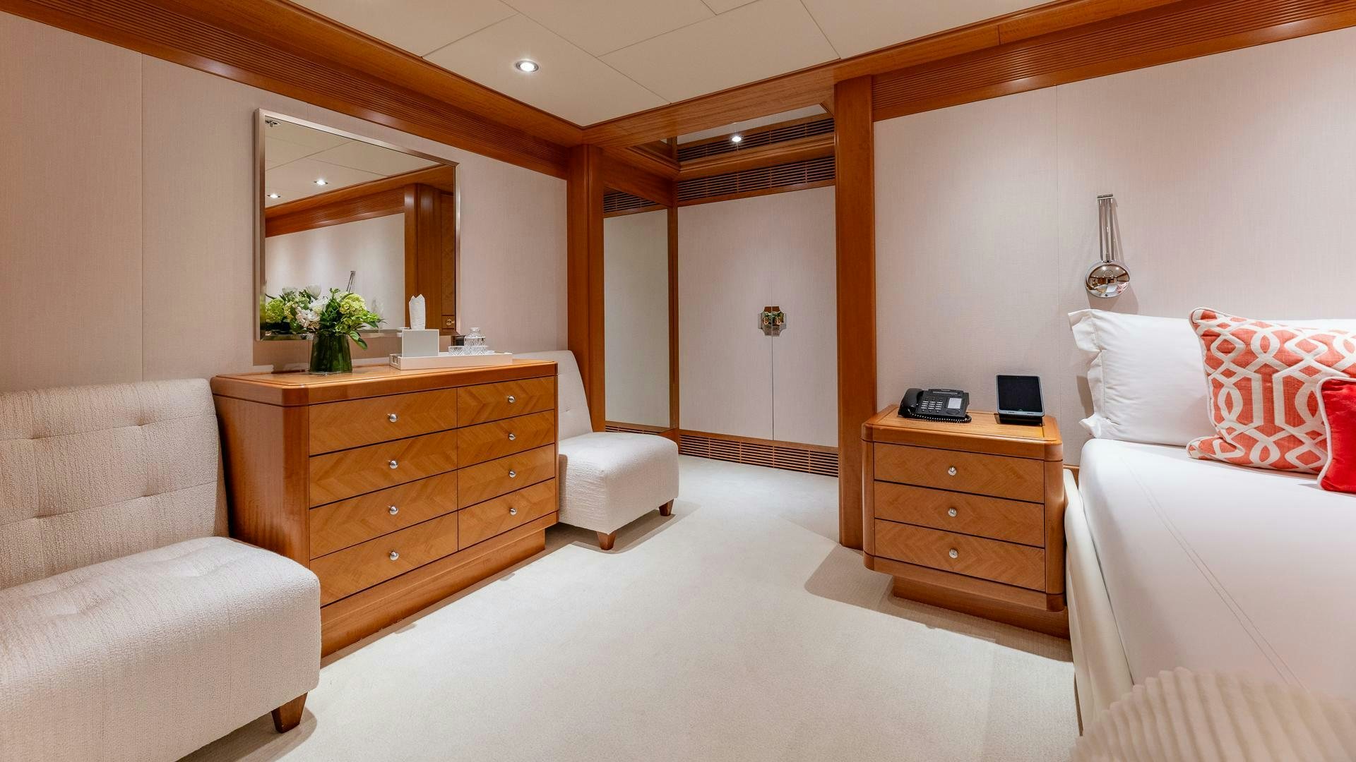 a room with a bed and a desk aboard AMANTI Yacht for Sale