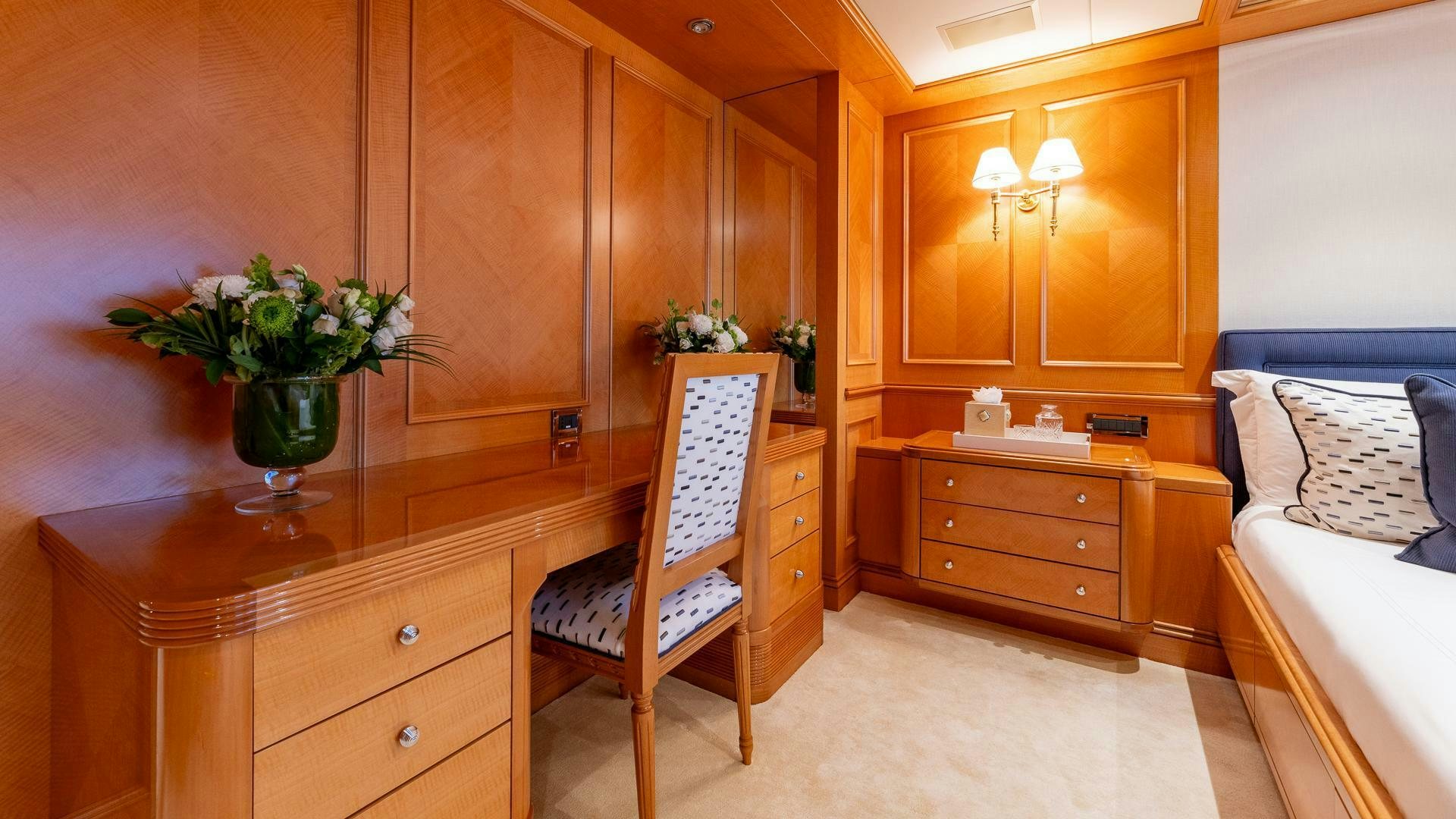 a room with a chair and a desk aboard AMANTI Yacht for Sale