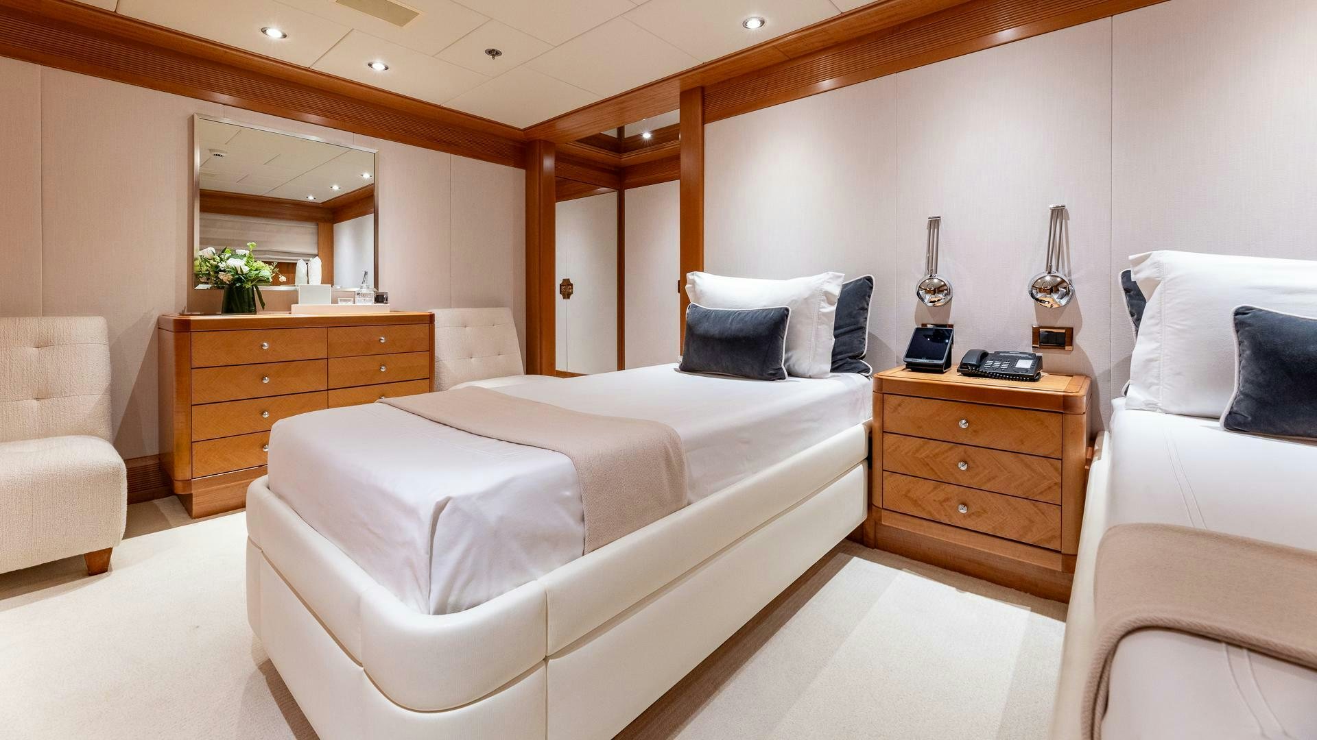 a room with a bed and a couch aboard AMANTI Yacht for Sale
