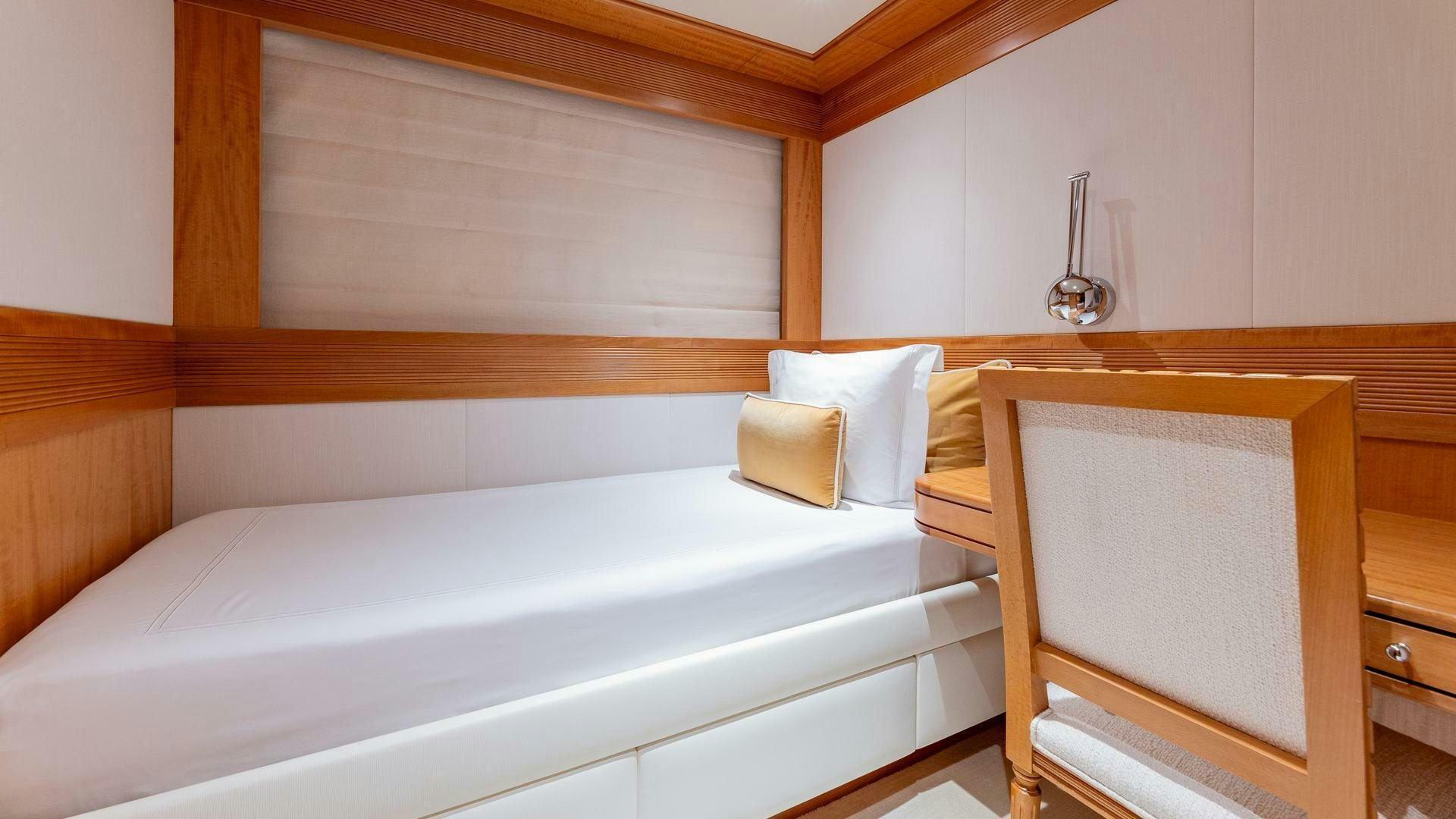 a bed with a white sheet aboard AMANTI Yacht for Sale