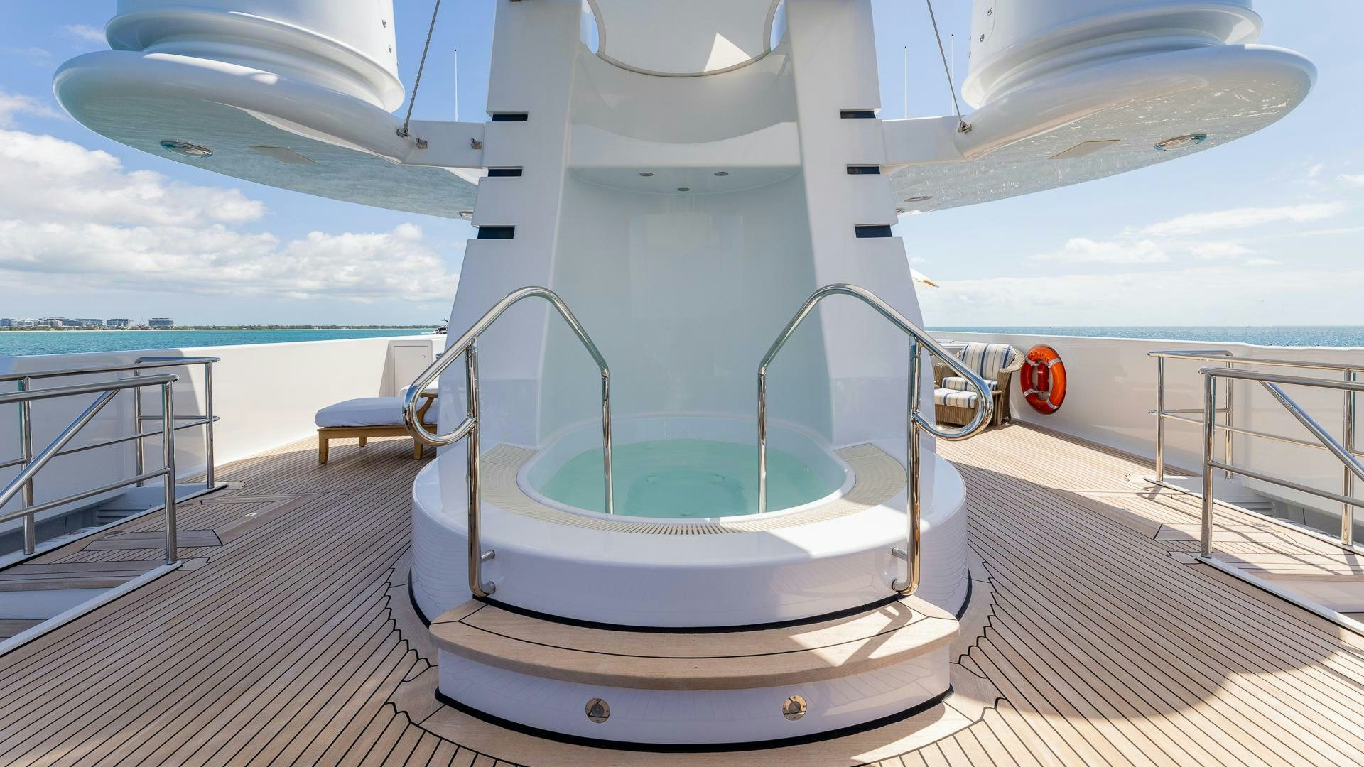 a large white boat on a deck aboard AMANTI Yacht for Sale