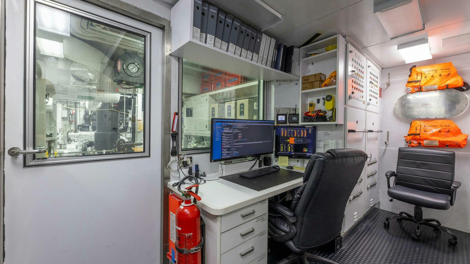 a room with a computer and a desk and a chair aboard AMANTI Yacht for Sale