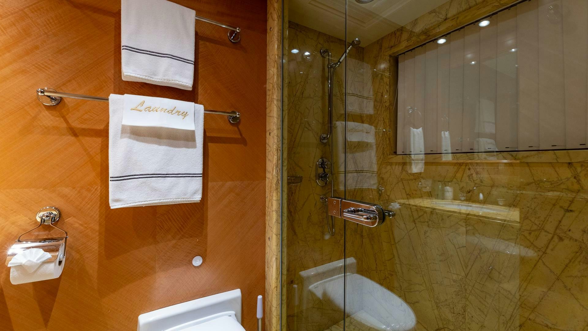 a bathroom with a glass shower aboard AMANTI Yacht for Sale