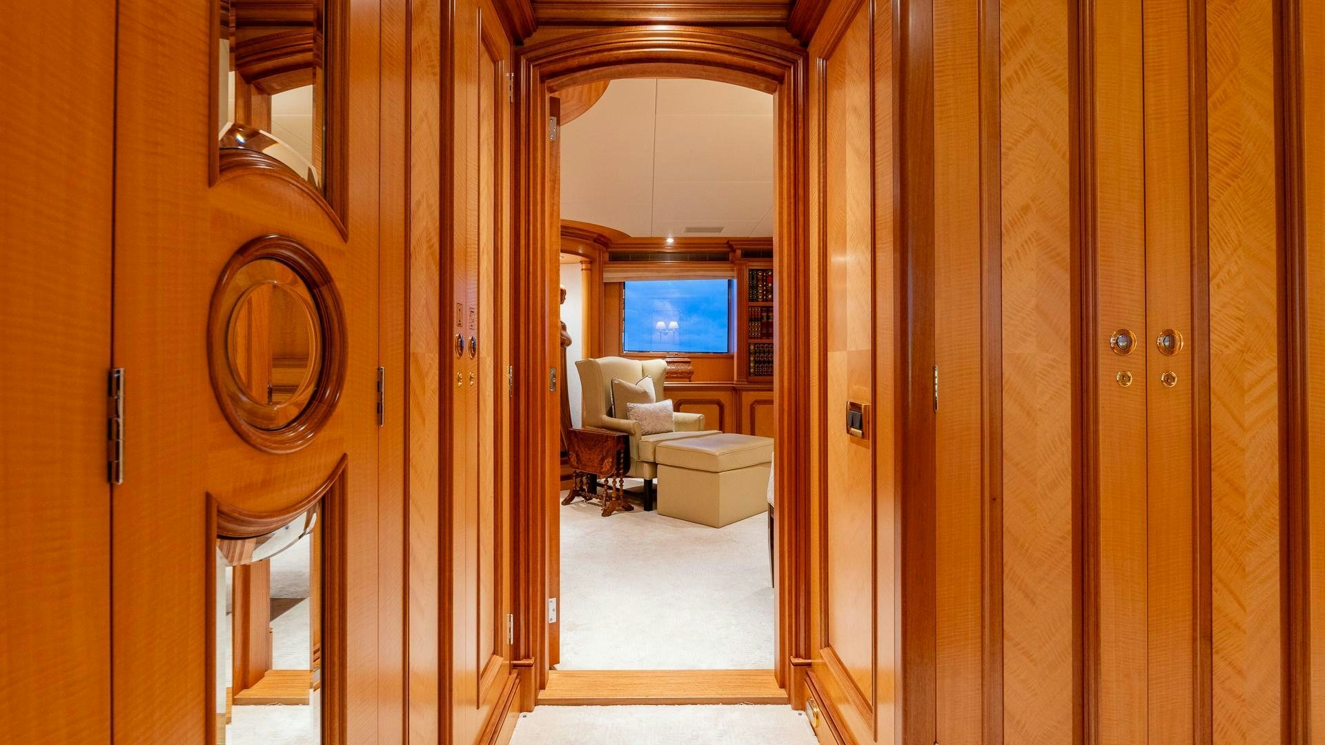 a room with a wood door and a mirror aboard AMANTI Yacht for Sale