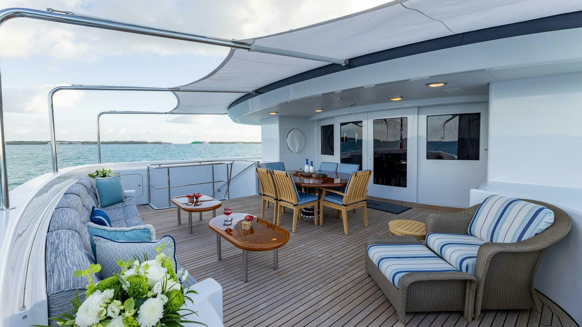 a large living room with a large balcony aboard AMANTI Yacht for Sale