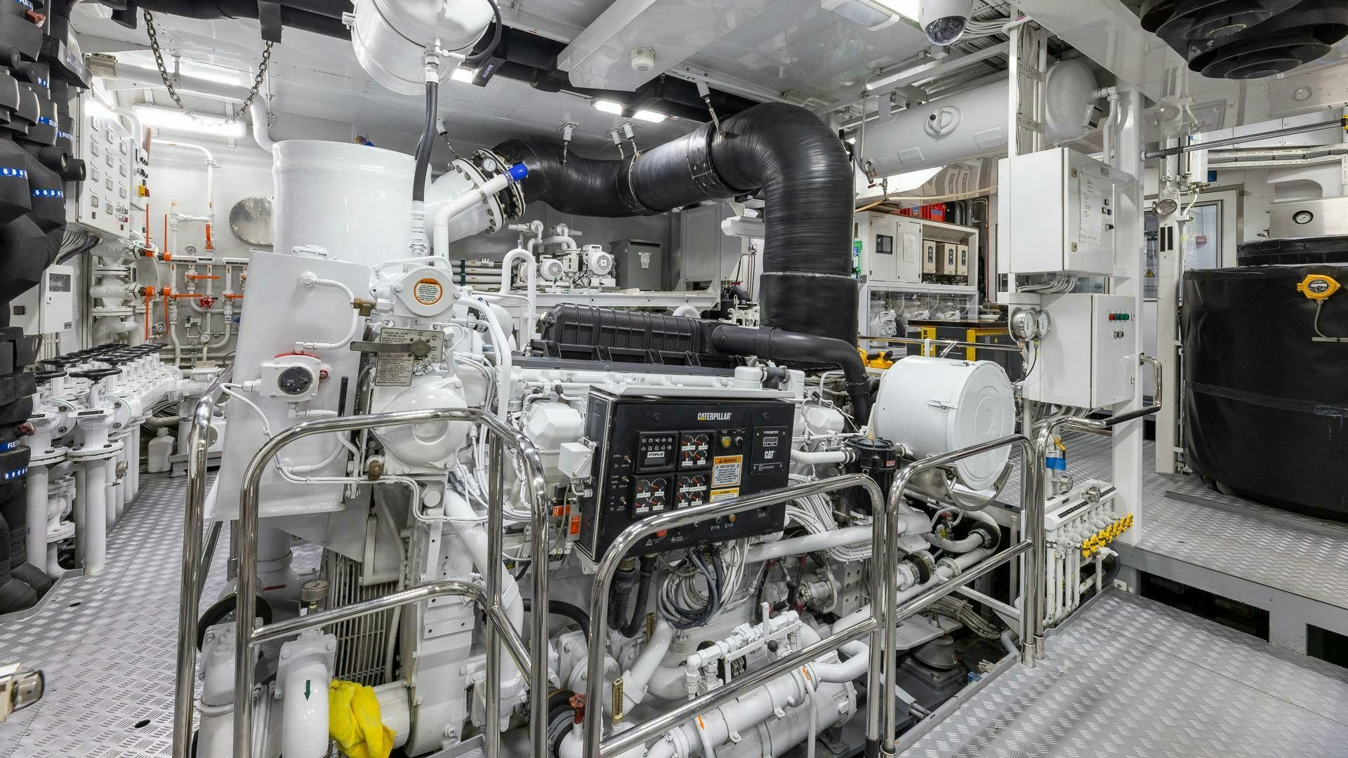 a large machine in a factory aboard AMANTI Yacht for Sale