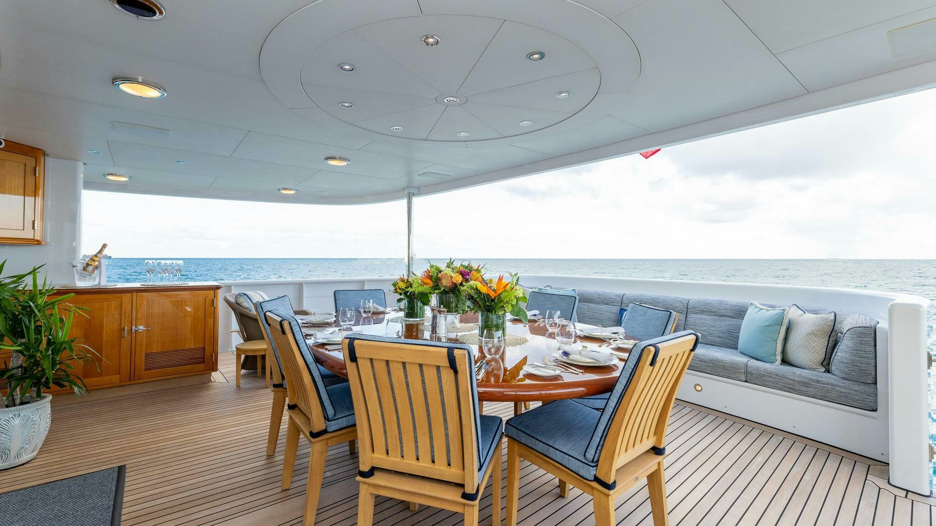 a dining room with a table and chairs aboard AMANTI Yacht for Sale