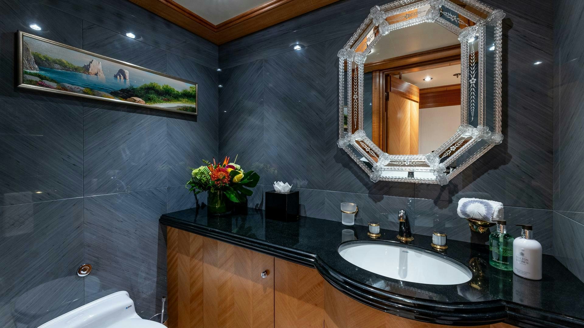 a bathroom with a large mirror aboard AMANTI Yacht for Sale